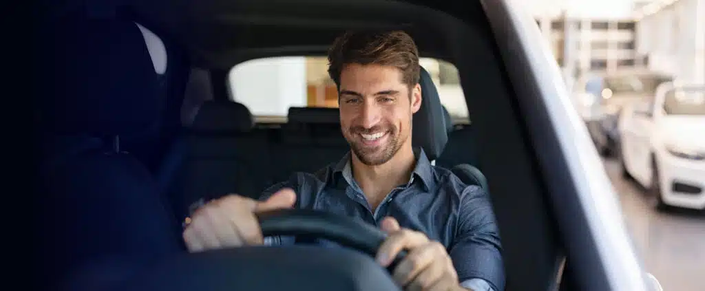 Person test driving a car left ext ed low